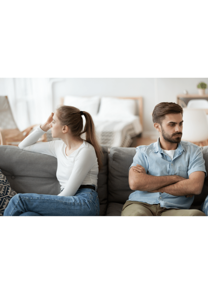 Image illustrating a couple sitting separated after discussing their separation and spousal equity buyout