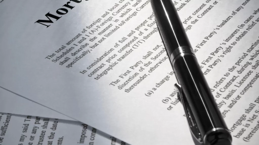 image of a mortgage purchase financing contract with a pen on it.
