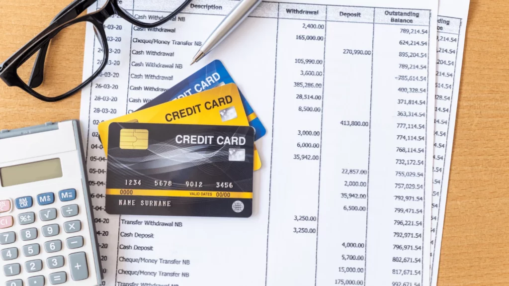 image of a debt consolidation budget with a calculator and credit cards beside it